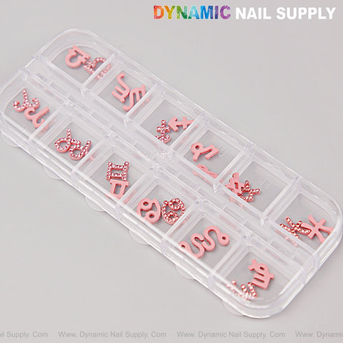 Clear case holds 24 pink rhinestone zodiac sign charms—perfect nail art DIY accessories from Twelve Constellation Gems.