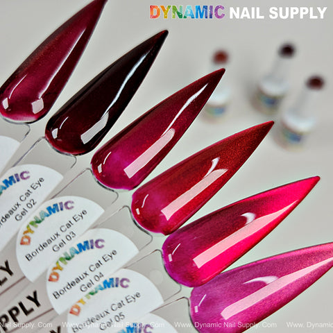 Five nails in gradient shimmery gel polish using Bordeaux Cat Eye #2, labels visible, from red to pink.