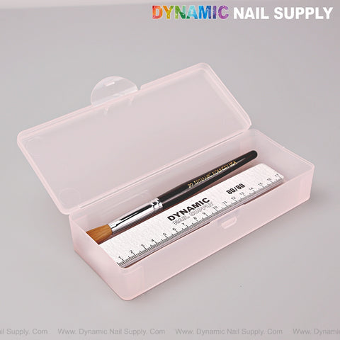 The Clear Pink Nail Brush Case holds a nail brush, silver nail file, and DYNAMIC-labeled metal ruler.