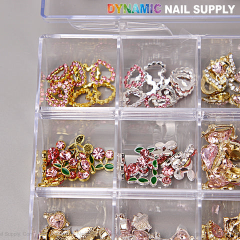 A clear box holds heart, cherry, crown, and planet charms—Pink Silver Gold Nail Art DIY Design Accessories.
