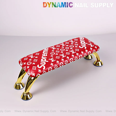 Red [R-A043] 5upreme Pattern Handrest Armrest for manicure/pedicure, gold legs; Dynamic Nail Supply logo above.