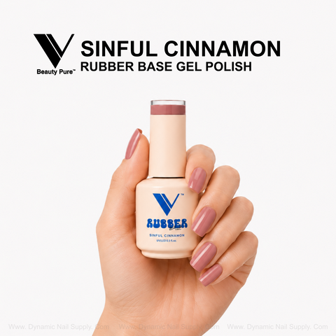 A mauve-manicured hand holds V Beauty Pure - Sinful Cinnamon Rubber Base Gel Polish against a white background.