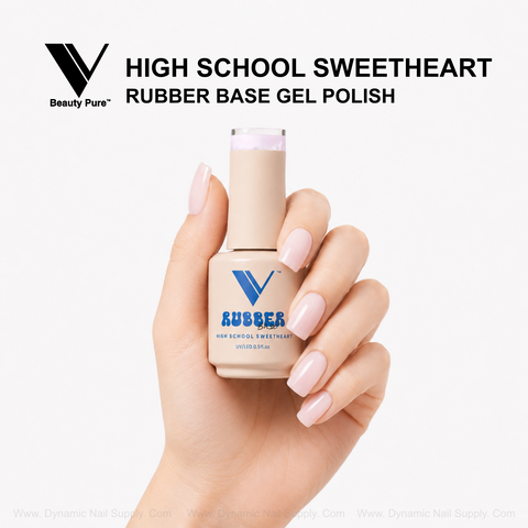 Hand with light pink nails holds V Beauty Pure High School Sweetheart Rubber Base Gel Polish against white background.