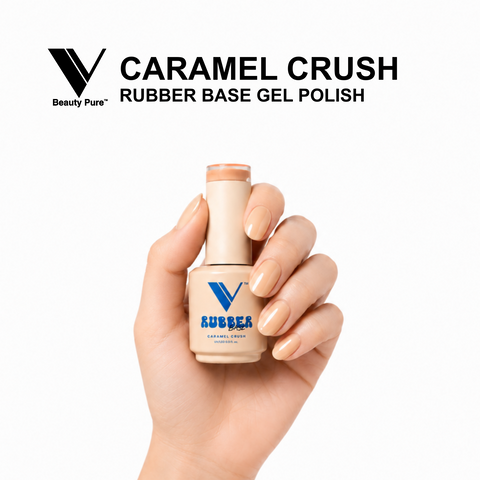 Hand holding V Beauty Pure Caramel Crush Rubber Base Gel Polish; nails in caramel nude with rubber base finish.