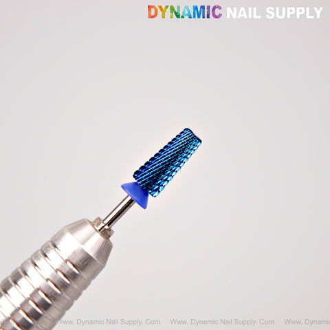 A blue 5-in-1 Medium Cross Cut Drill Bit from Dynamic Nail Supply is shown with a silver nail drill on a plain background.