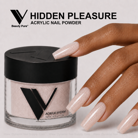 A hand with long, light pink nails touches a jar of V Beauty Pure - Hidden Pleasure Acrylic Powder for pros.