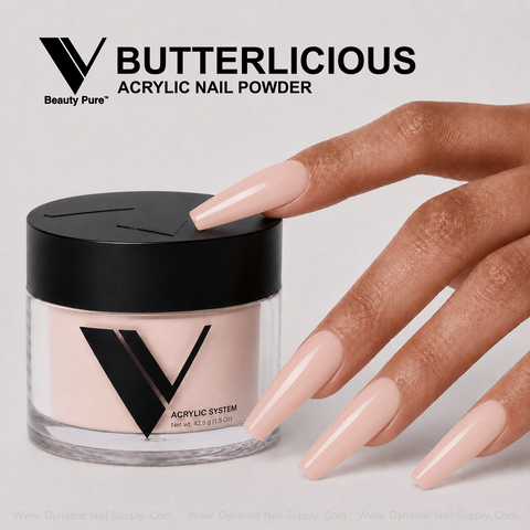 A hand with long, glossy nude acrylics holds V Beauty Pure - Butterlicious Acrylic Powder, perfect for nail art lovers.