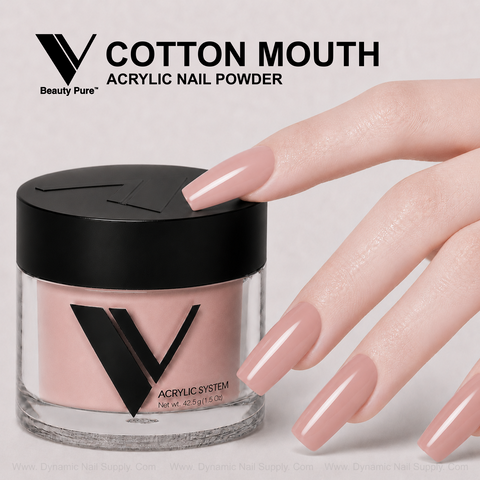 A hand with long, glossy nude pink nails holds V Beauty Pure - Cotton Mouth Acrylic Powder for salon-style enhancements.