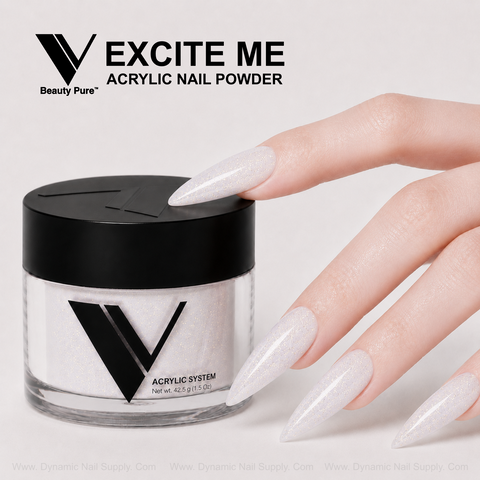 A hand with glittery acrylic nails points to a jar of Excite Me - V Beauty Pure Acrylic Powder for salon-style nails.