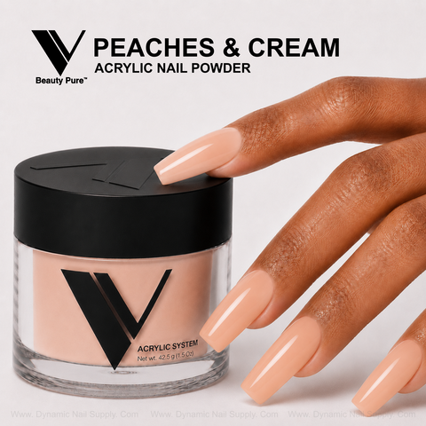 A hand with long peach nails rests by V Beauty Pure - Peaches & Cream Acrylic Powder, a top nail pro supply.