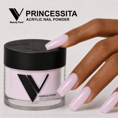 A hand with glossy pale pink nails holds V Beauty Pure - Princessita Acrylic Powder against a gray background.