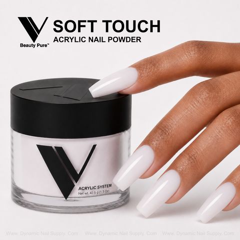 A hand with long, milky nails touches a V Beauty Pure - Soft Touch Acrylic Powder jar for baby boomer nails.