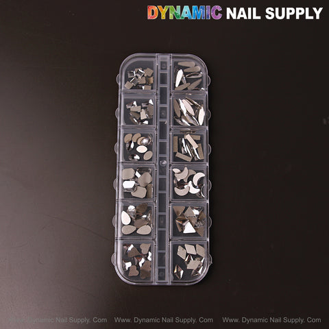A clear case holds [Silver 3] Mixed Raindrop Square Heart Moon Nail Rhinestone Gems; “DYNAMIC NAIL SUPPLY” above.