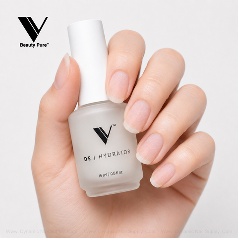 A hand holds a V Beauty Pure - Nail Prep Dehydrator, ideal for salon nail prep and enhancing manicure adhesion.
