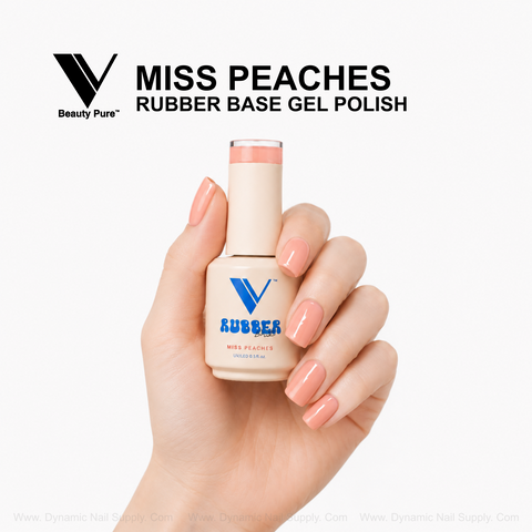 Glossy peach nude gel nails grip a V Beauty Pure Miss Peaches Rubber Base Gel Polish bottle against a white background.