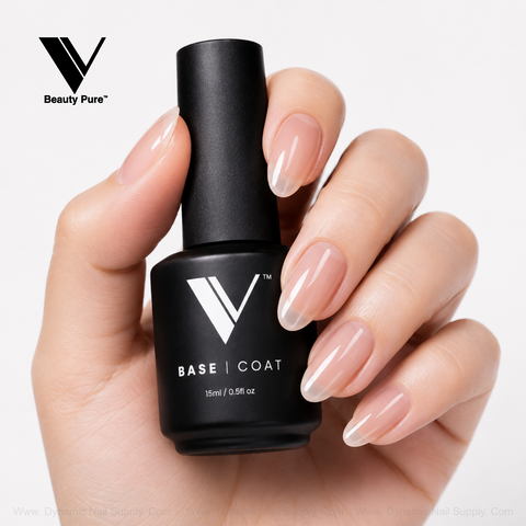 Glossy, natural nails hold a V Beauty Pure - Long Lasting Base Coat bottle against a white background.