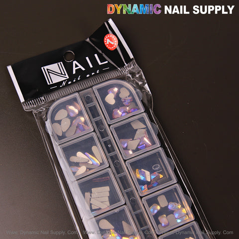 A black package of Volcano AB 7 nail rhinestone gems in 12 mixed shapes, labeled “Nail Nature.”.