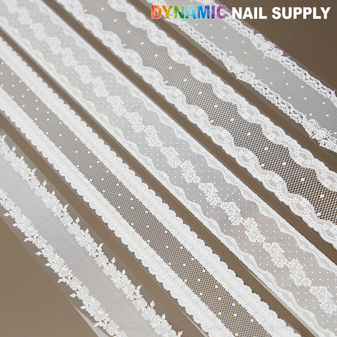 Five strips of White Mixed Design Nail Foil 4, perfect for intricate nail art from DYNAMIC NAIL SUPPLY.