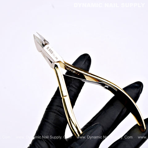 A gloved hand holds the D555 Professional Cuticle Nippers with a high-tension spring and full jaw against a white background.