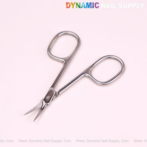 NT1215 - Silver Premium Curved Tip Cuticle Scissors on a light pink background with “Dynamic Nail Supply” above.