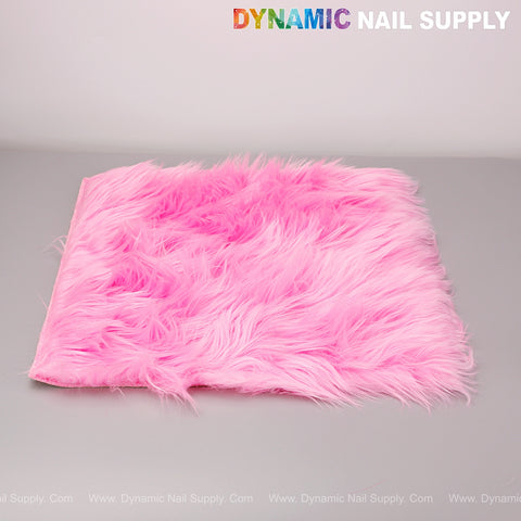 A Hot Pink Faux Fur Fabrics Square Display Mat for nail art photos rests on gray, with DYNAMIC NAIL SUPPLY above.