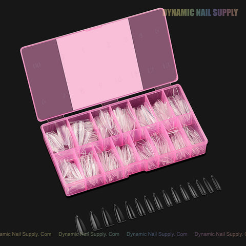 A pink box of Natural Stiletto (Long) Soft-Gel Nail Tips is shown; black nail tips are displayed below on black.