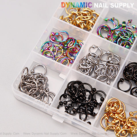 Organizer box with gold, silver, titanium, black punk nail charms—DYNAMIC NAIL SUPPLY Y2K DIY set.