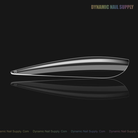 A single Natural Stiletto (Long) Full Cover Soft-Gel Nail Tip is shown on a black background with a subtle reflection.