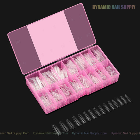 A pink box of Natural Coffin (Long) Full Cover Soft-Gel Nail Tips with black sample nails on a black background.