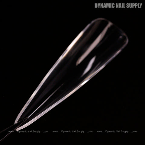 Sculpted Stiletto XL Full Cover Soft-Gel Nail Tip (Black Box) shown on black with “Dynamic Nail Supply” above.