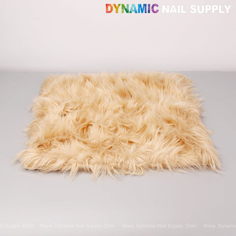A Tan Faux Fur Fabrics Square Display Mat is on a light gray surface; DYNAMIC NAIL SUPPLY is shown at the top.