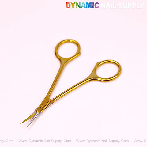 NT1245 - Gold Premium Curved Tip Cuticle Scissors on light pink with Dynamic Nail Supply logo at the top.