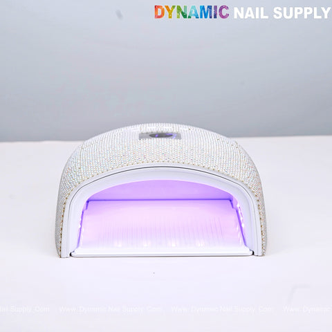 The AB and Pearl Rhinestone Cordless 48W LED/UV Gel Nail Dryer is a rechargeable, fast-curing gel polish lamp.