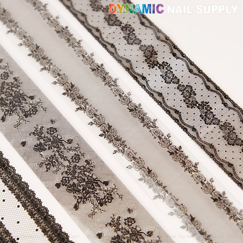 Four rolls of Black Mixed Design Nail Foil 5 featuring sheer black floral and dotted patterns, arranged on white.