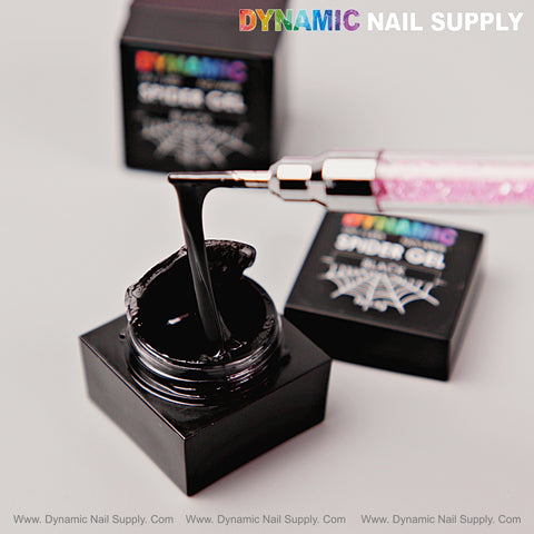 A brush lifts No-wipe Ready for Chrome Spider Gel for Lines, Spider Webs from a square pot on a light background.