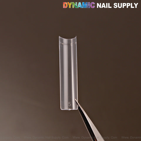 A clear XXL Ultra Thin Square Nail Tip (Not C-Curve) is held by tweezers, with the logo at the top right corner.