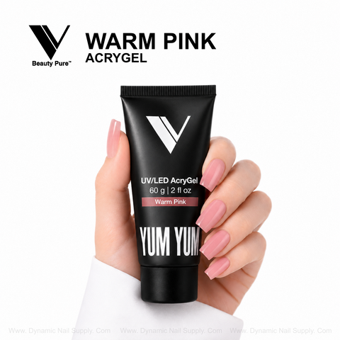 A hand with long, pink nails holds Warm Pink - V Beauty Pure AcryGel, a pro hybrid for salon-style enhancements.