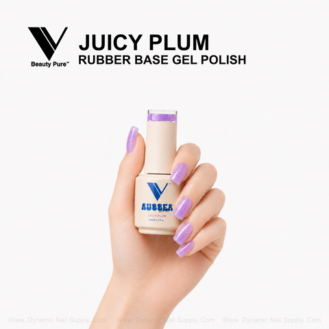 Hand with sparkling plum nails holds a V Beauty Pure Juicy Plum Rubber Base Gel Polish bottle against a white background.