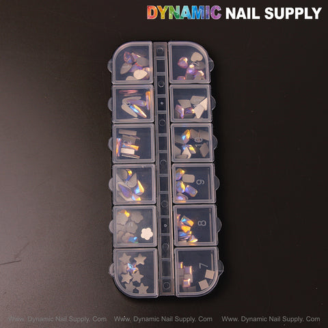 The Volcano AB 7 organizer holds 12 mixed shapes of nail art rhinestone gems on a black background.