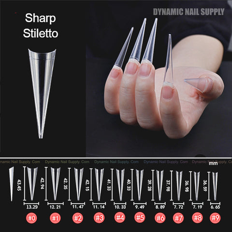Hand with XXL Sharp Stiletto Nail Tips Extensions—500 pcs, 10 sizes, clear half-cover tips shown with measurements.