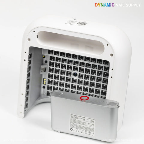 The ONAIL AI Camera Nail Lamp UV/LED is shown in white with its back cover open, revealing the LED grid and power pack.
