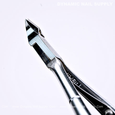 Close-up of D506 Professional Carbon Steel Cuticle Nippers by DYNAMIC NAIL SUPPLY on a white background.