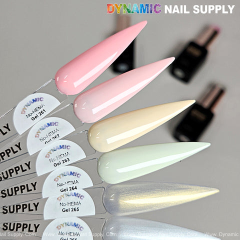 Six pointed tips display Dynamic No-HEMA Gel Polish Colors 261–270, with blurred gel polish bottles in the background.
