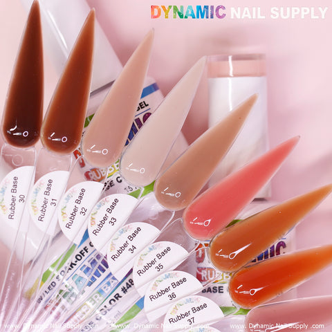 A collection of eight nail polish swatches showcases shades from dark brown to light beige and pink, each marked with the (BIAB) Rubber Base gel and numbered 30 to 37. A white bottle stands in the background alongside the vibrant Dynamic Nail Supply logo, emphasizing its soak-off gel formula.