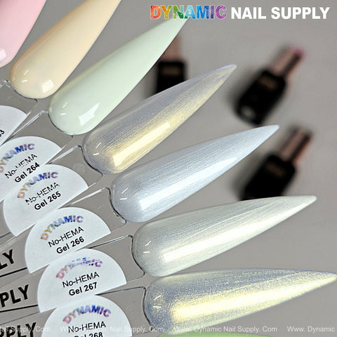 Five Dynamic No-HEMA Gel Polish samples in shades 261-270, labeled by color with blurred bottles in the background.
