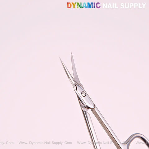 NT1246 Silver Premium Curved Tip Cuticle Scissors, stainless steel, open on light background with DYNAMIC NAIL SUPPLY logo above.