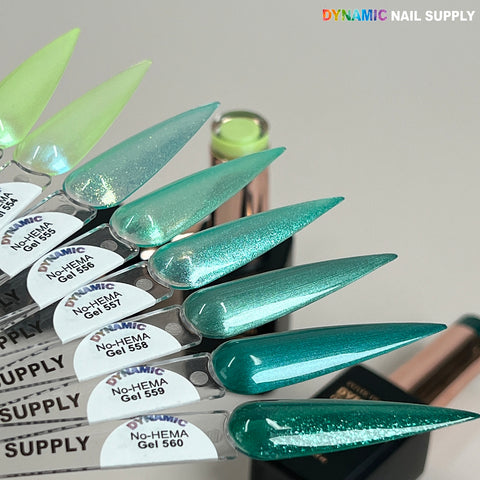 Five Dynamic No-HEMA Gel Polish swatches (colors 556–560) are shown on clear sticks above their bottles.