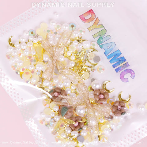 Luxury White Pearls and Brown Flowers with Leaves Set (Gold Theme) for nail art design, labeled DYNAMIC in rainbow letters.