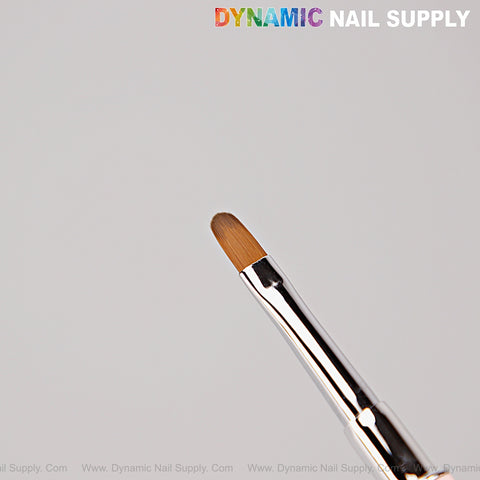 Close-up of Silver Pink Builder Poly Hard Gel Dual Head Nail Art Brush—oval brush head, spatula, shiny metal handle.