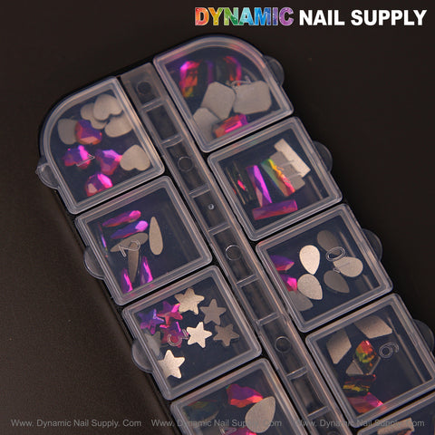 A plastic box holds Fuchsia AB 8 Nail Art Rhinestone Gems in 12 shapes, including hearts, moons, and raindrops.